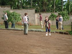 Volunteers play football in the volunteer house compound