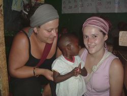 Kenya Volunteer Orphanage - Volunteers caring for a child