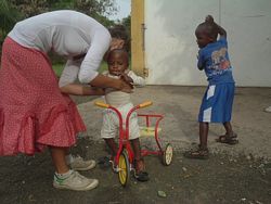 Kenya Volunteer Orphanages - A Volunteer plays with Kids in an Orphanage.